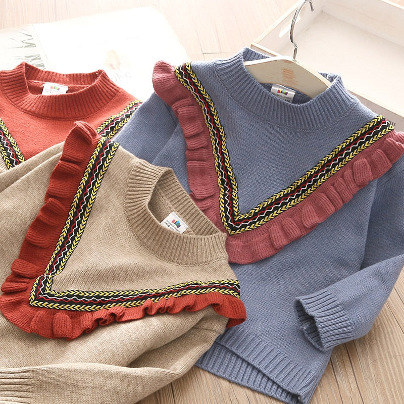 Dziewczęcy dzianinowy sweter z falbankami